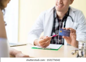 asian-doctor-showing-credit-card-260nw-1531776542