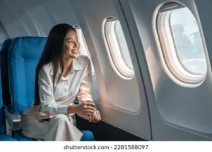 asian-woman-sitting-seat-airplane-260nw-2281588097