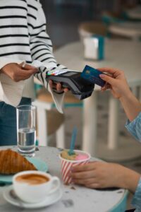 person-paying-with-nfc-technology-restaurant_23-2150039463