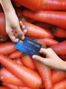 spending-buying-vegetables-carrots-paying-by-credit-card_63145-286