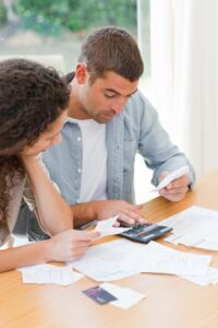 young-couple-calculating-their-domestic-bills_13339-259869