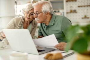 senior-couple-analyzing-their-savings-while-going-through-home-finances_11zon